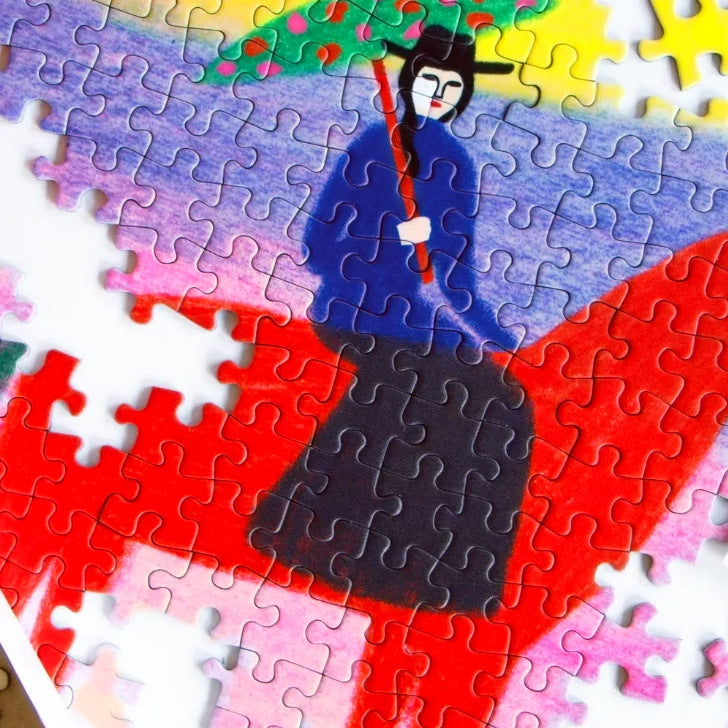 CHEVAL ROUGE by Anne Laval – close-up of the jigsaw puzzle being assembled