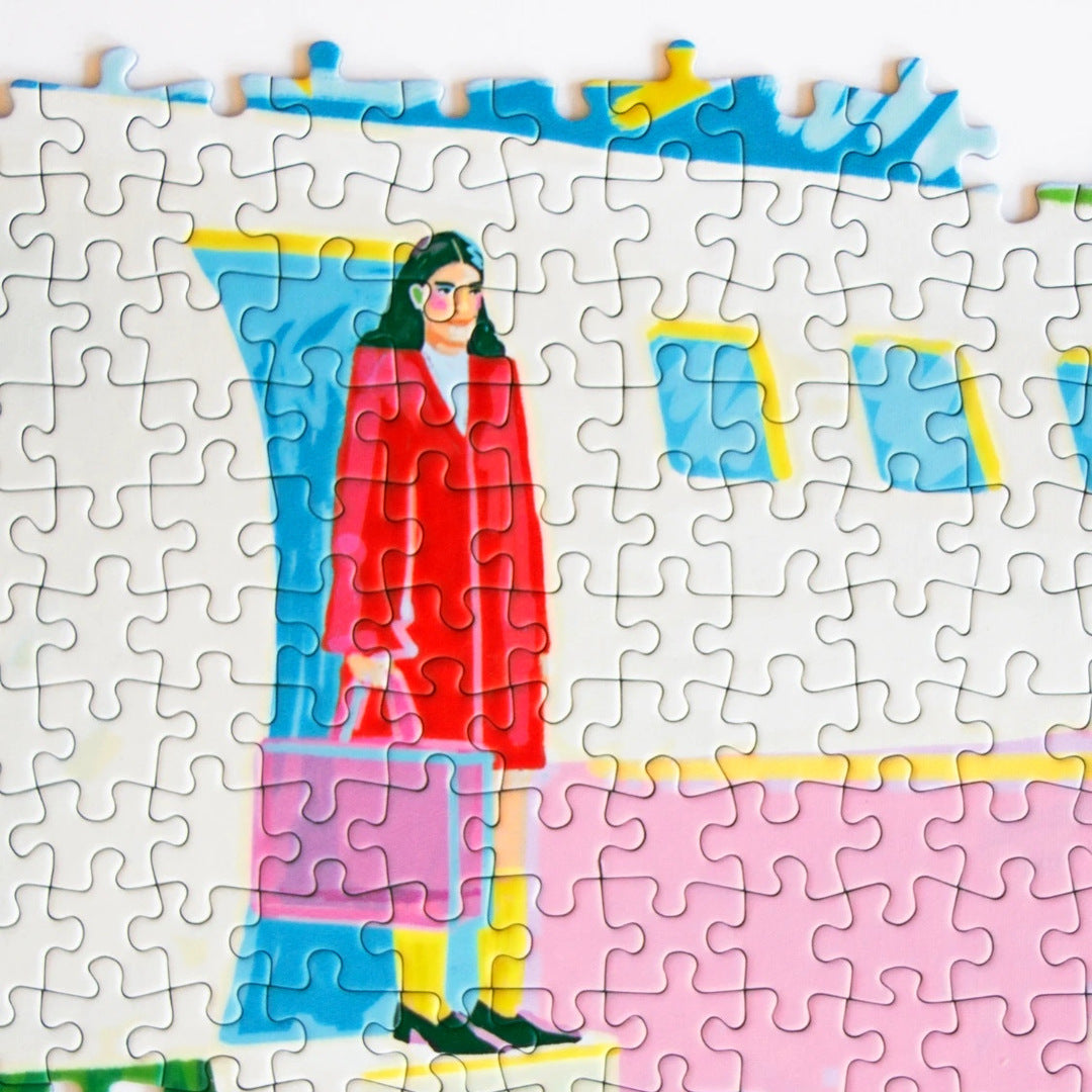 ARRIVAL by Niege Borges – close-up of the jigsaw puzzle being assembled